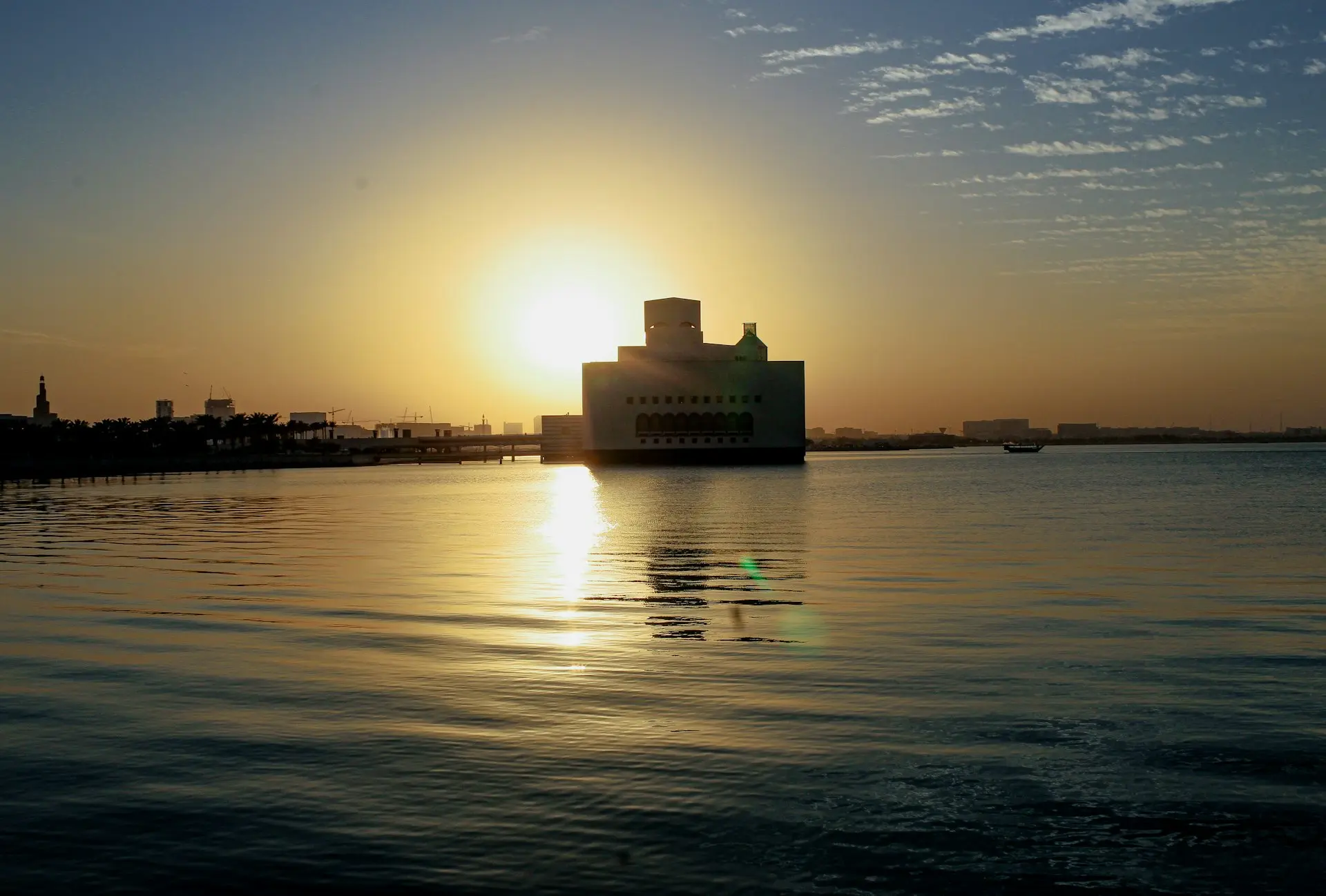 The sun is setting over a body of water